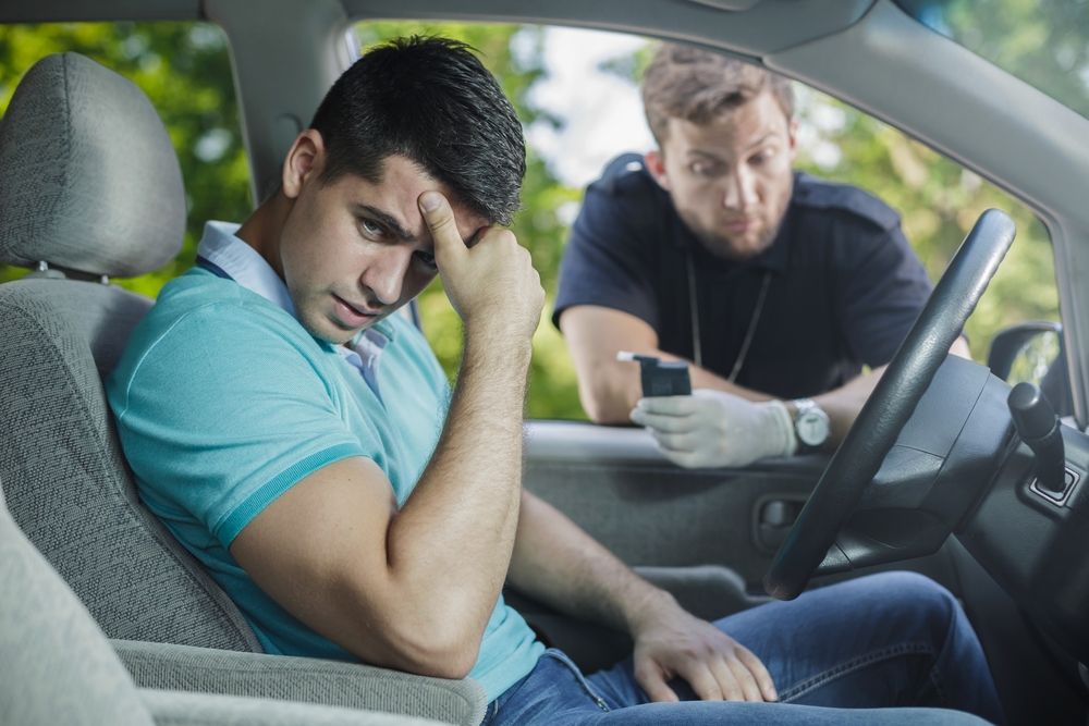 worried young driver caught on driving after alcohol